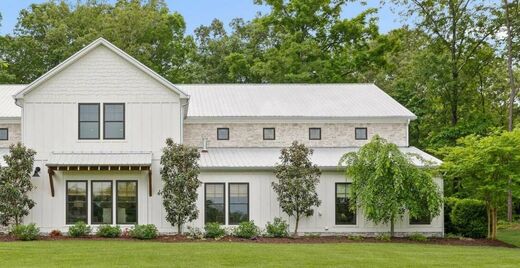 Modern farmhouse-style home exterior, representative of the team's residential listings