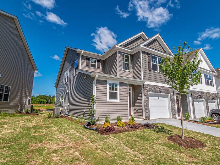 Craftsman-style duplex townhome, representative of the team's investment listings
