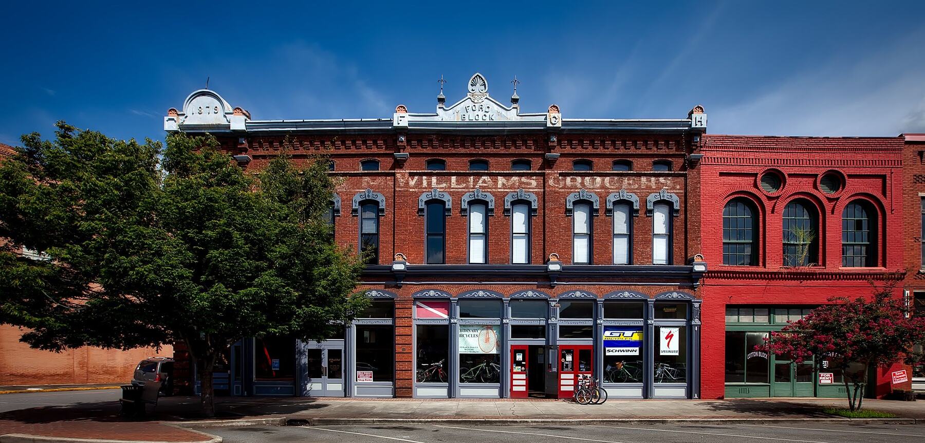 Historic brick storefront building on a downtown block