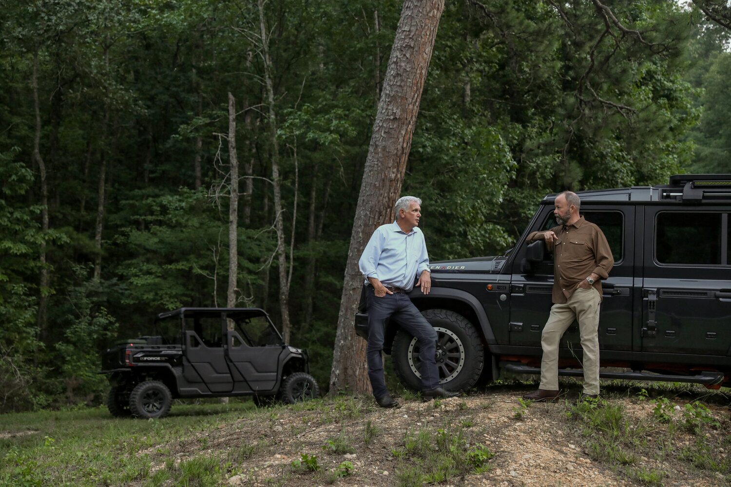 Geoff Ramsey and Geoff Hurdle reviewing a wooded investment tract