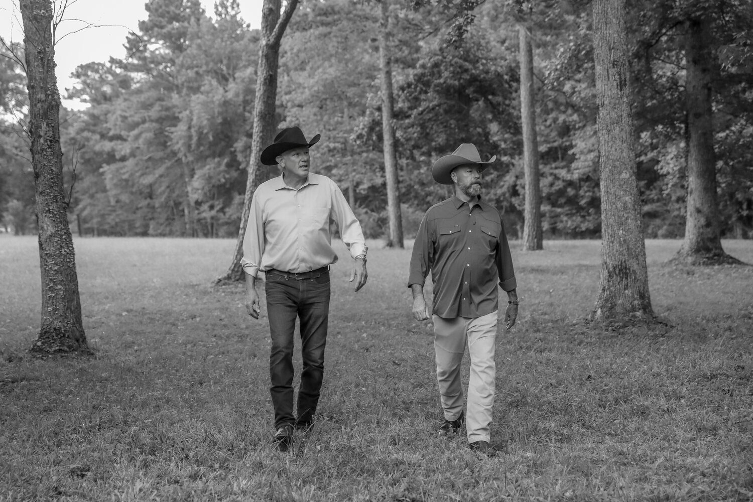 Geoff Ramsey and Geoff Hurdle walking a wooded land parcel together